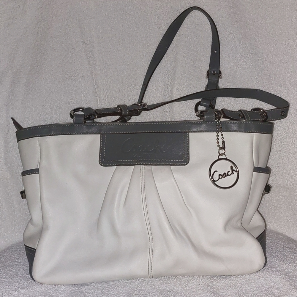 Coach Pocketbook; off-white with gray trim and a purple lining